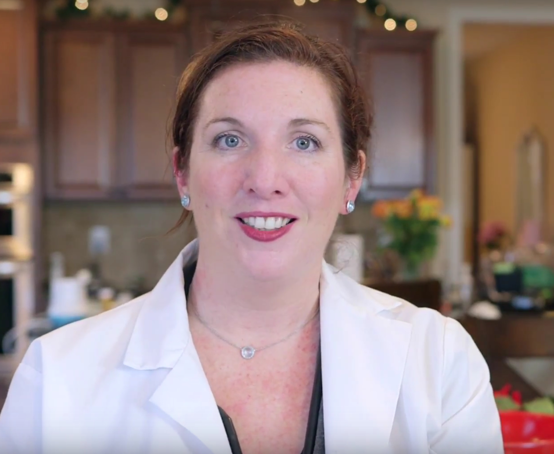 Bio photo of Dr.Mary Marcotte smiling in a white lab coat